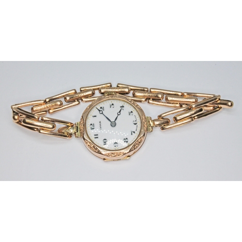 276 - A 9ct gold cased Cyma ladies watch with enamelled dial, sprung bracelet strap marked '15ct', gross w... 