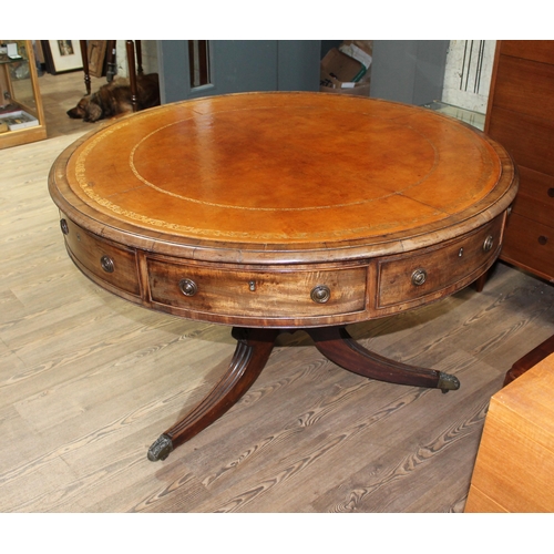 299 - A Regency mahogany drum table, revolving tooled leather top, four drawers, three dummy drawers and o... 