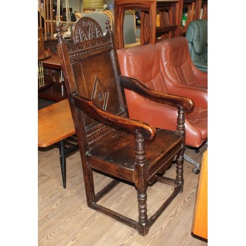 302 - A 17th century joined oak armchair.