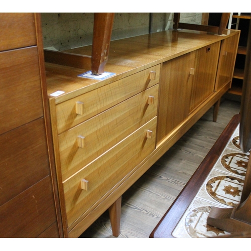 306 - A mid 20th century sycamore sideboard, possibly Alfred Cox for Heals, unmarked, length 220cm.