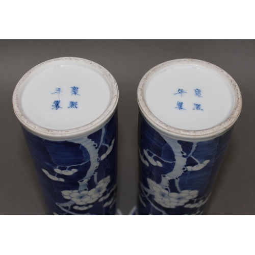 339 - A pair of Chinese porcelain blue and white sleeve vases, each bearing four character Kangxi mark, he... 