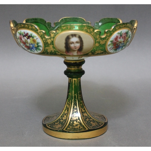 341 - A Bohemian green glass tazza, with painted portrait and floral panels within gilt decoration, height... 