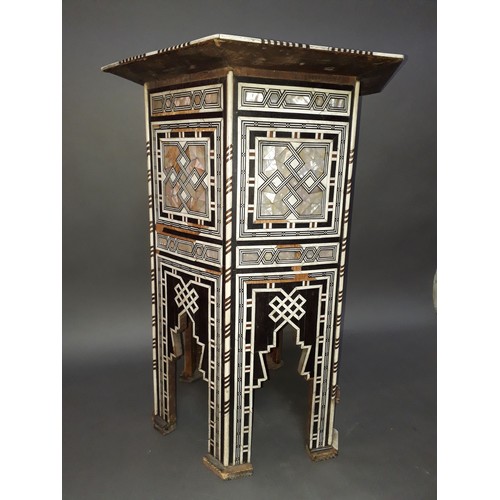 301 - A Moorish bone and mother of pearl inlaid occasional table, height 78cm.