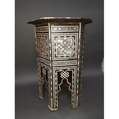 301 - A Moorish bone and mother of pearl inlaid occasional table, height 78cm.