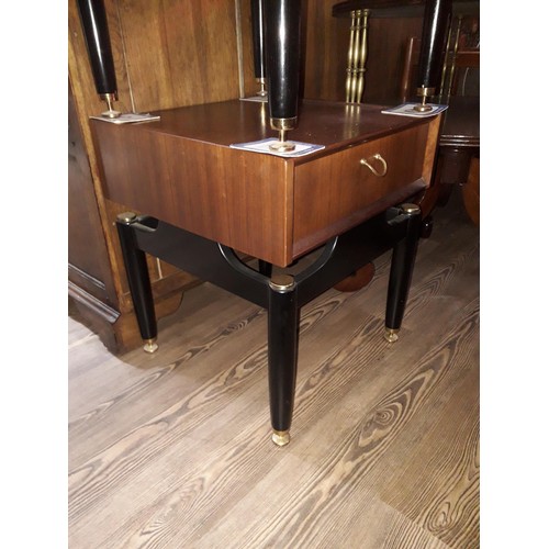 325 - A pair of G-Plan teak and black bedside cabinets.