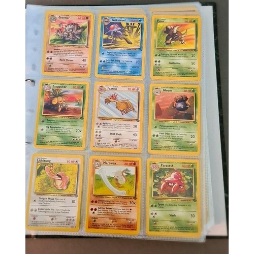 161 - A collection of Pokemon cards including folder of 1990s cards, a plastic folder of Neo promotional c... 