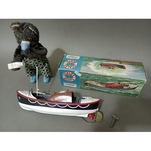 164 - A vintage 1960s Scales Boats lifeboat - clockwork in original box together with a vintage mechanical... 