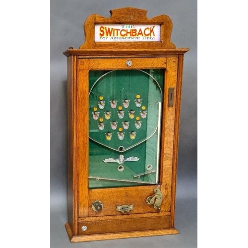 403 - An early 20th century vintage Switchback penny arcade, with keys and ball bearings.