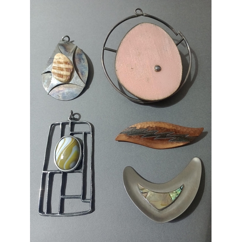 52 - A group of five modernist brooches.