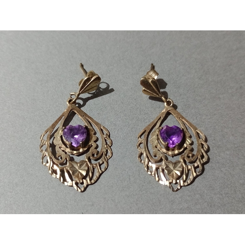 65 - A pair of gold amethyst earrings.