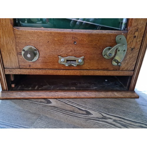 403 - An early 20th century vintage Switchback penny arcade, with keys and ball bearings.