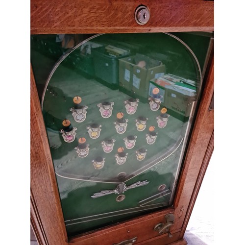 403 - An early 20th century vintage Switchback penny arcade, with keys and ball bearings.