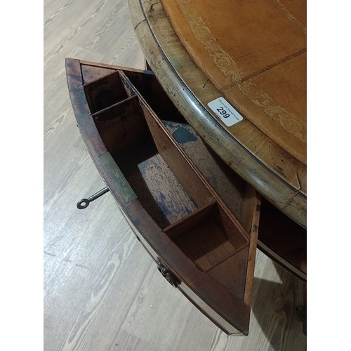 299 - A Regency mahogany drum table, revolving tooled leather top, four drawers, three dummy drawers and o... 