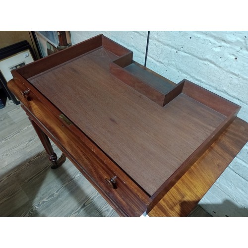 297 - A Gillows mahogany chamber writing table, second quarter of the 19th century, inkwell compartment, s... 