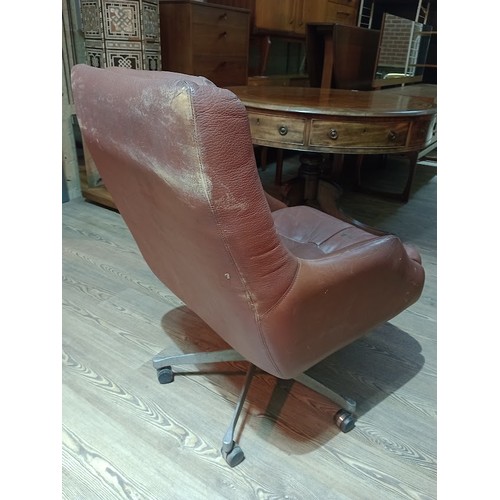 318 - A pair of Norwegian Ring Mekanikk tan leather lounge swivel chairs, previously the property of Jack ... 