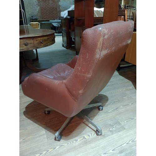 318 - A pair of Norwegian Ring Mekanikk tan leather lounge swivel chairs, previously the property of Jack ... 