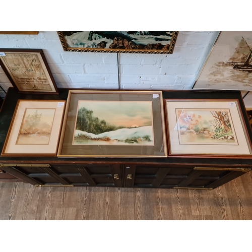 889 - Cliff Didsbury, three watercolours, a winter scene (46cm x 30cm) and two lake scenes with swans in f... 