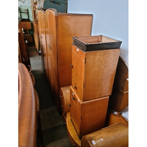 A suite of Art Deco birdseye maple bedroom furniture comprising two