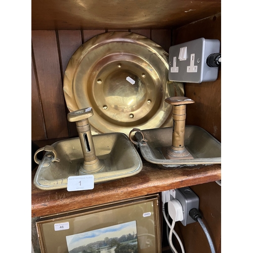 1 - A brass charger and two brass candlesticks.