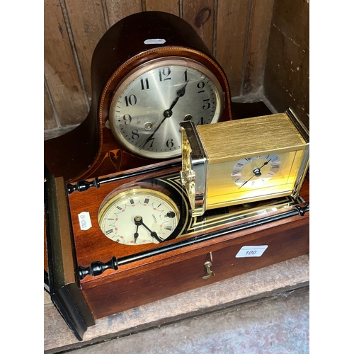 100 - A 31 day wall clock, an Edwardian inlaid mahogany mantle clock and a brass carriage clock.