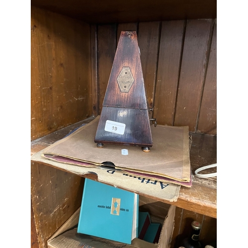 19 - A vintage French metronome and some old gramophone records.