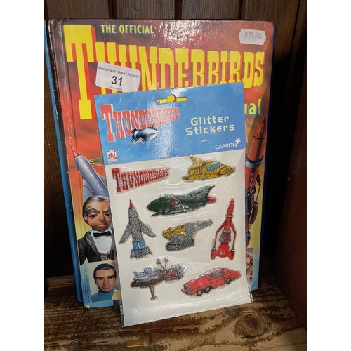 31 - Three Thunderbird annuals and a sticker set.