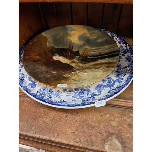 58 - A blue and white Minton charger and an oil painting on plate.