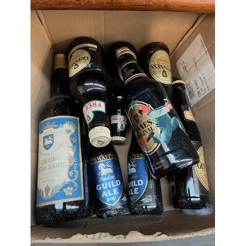 59 - A selection of alcoholic beverages to include Guiness, cream sherry and ale to include 3 Preston Gui... 