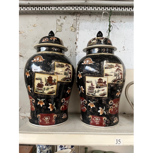 631 - A pair of early 20th century Chinese famille noire lidded vases, height 50cm.