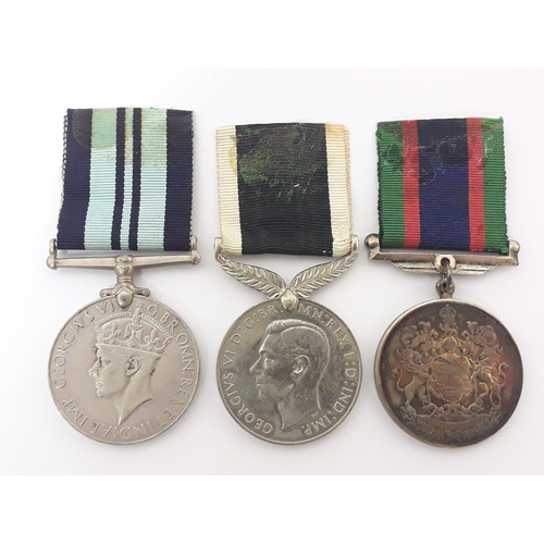 91 - A group of three unnamed medals comprising a Canadian Volunteer Service Medal 1939-45, New Zealand W... 