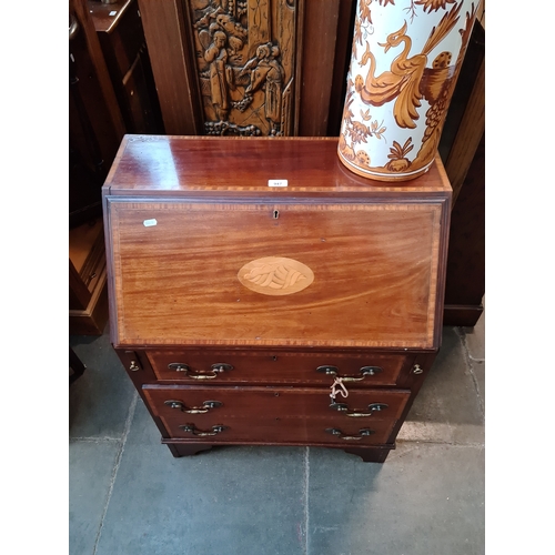 947 - An Edwardian inlaid mahogany bureau.