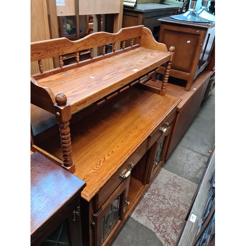 950 - An oak mirror back sideboard and a folding wine rack.