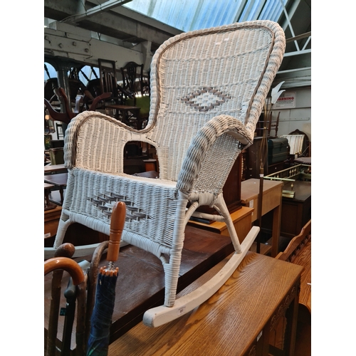 951 - A wicker rocking chair, a LLoyd Loom bedroom chair and two leather top side tables