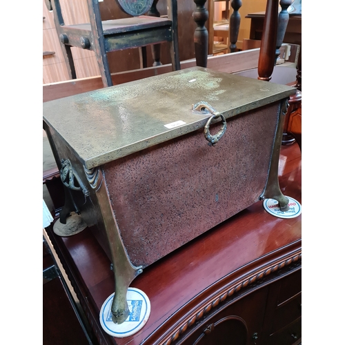 958 - An Edwardian copper and brass coal scuttle.