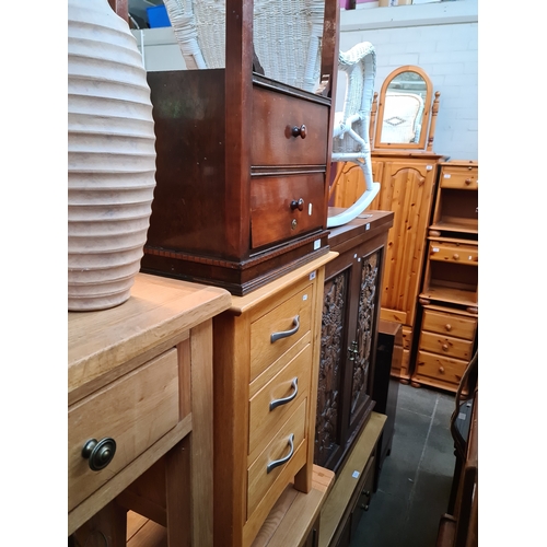 962 - A light oak bedside chest, a mahogany bedside cabinet, a ceramic vase and a brass multi-branch floor... 