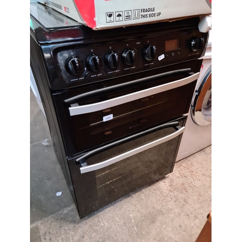 1084 - A Hotpoint gas oven with four ring hob.