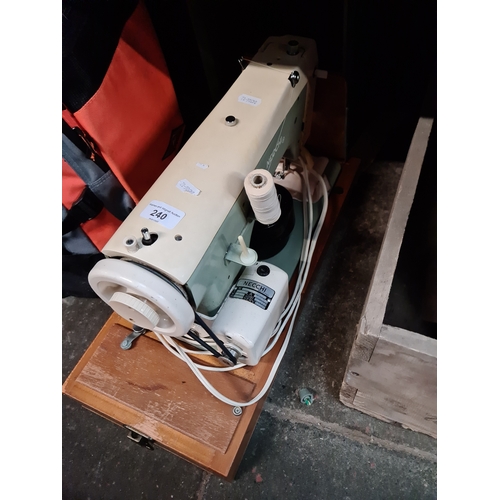 240 - A Necchi electric sewing machine with pedal.