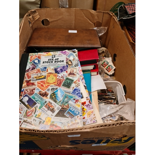 251 - A box of stamp albums, covers and loose stamps etc.