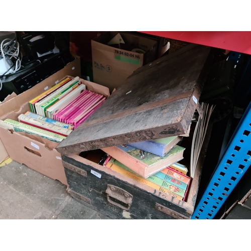 261 - A vintage wooden chest / trunk and a box of books.