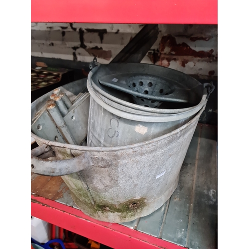 294 - A galvanised metal bath, galvanised mop bucket and four large galvanised hinges.