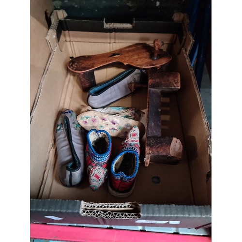 299 - 3 pairs of Chinese silk shoes and a pair of wooden shoes.