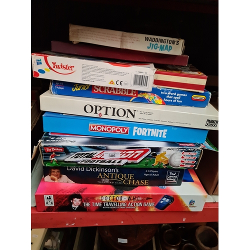 306 - A collection of board games including Scrabble, Monopoly, Dominoes, Backgammon etc.