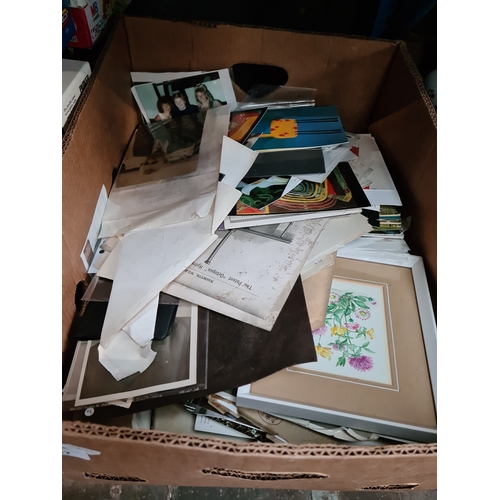 307 - A box of vintage postcards, photographs and ephemera