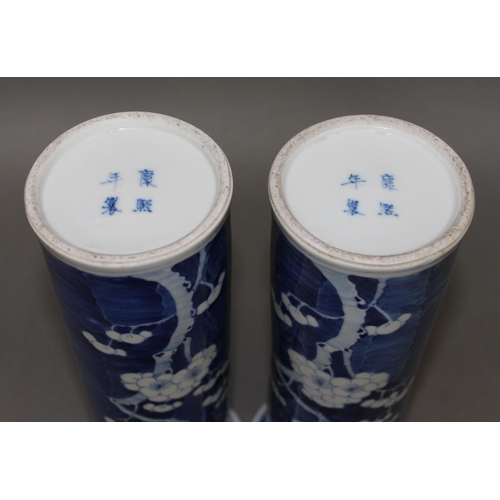 105 - A pair of Chinese porcelain blue and white sleeve vases, each bearing four character Kangxi mark, he... 
