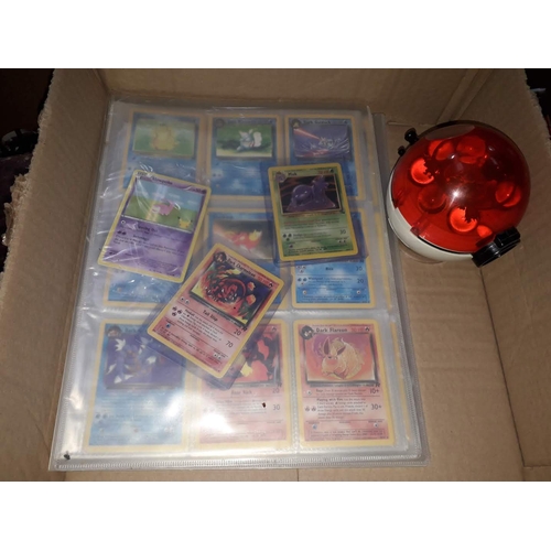 115 - A box containing two binders of vintage 1990s Pokemon cards together with a vintage Pokemon marble b... 