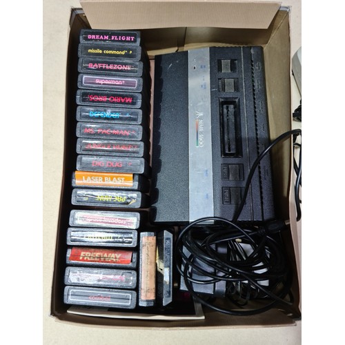 121 - Two Atari 2600 games consoles with assorted games, various Megadrive games and a PS1 with two contro... 
