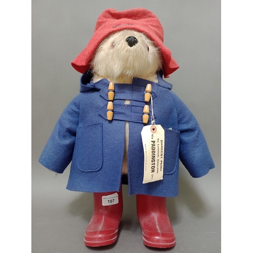 107 - A Gabrielle Designs Paddington Bear with labels.