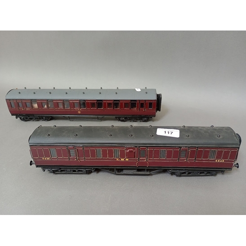 117 - Two 0 gauge maroon coaches.