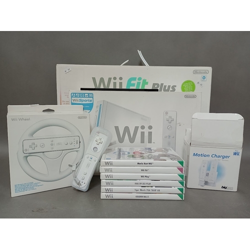 122 - A Nintedo Wii console, Wii Fit Plus board, various games and accessories.
