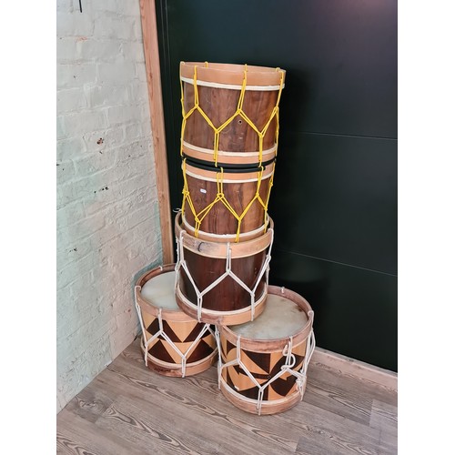 145A - A set of 5 wooden drums with straps.